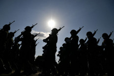 Thai soldiers march during celebrations to mark Royal Thai Armed Forces Day at Chulabhorn Camp in the southern Thailand province of Narathiwat on January 18, 2022. 
