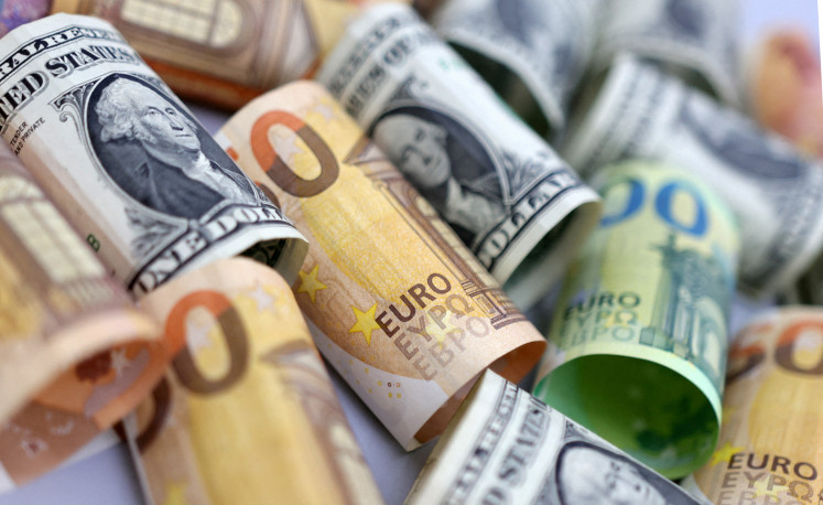 US dollar and euro banknotes are seen in this illustration photo taken on July 17, 2022.