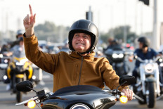Brazilian President Jair Bolsonaro demonstrating his 'military strong man' credentials by riding a motorbike.
