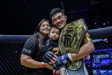 ONE Lightweight World Champion Christian Lee celebrates his victory at ONE 160 on Friday, Aug. 27, with his family.
