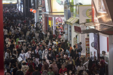 Visitors browsing exhibition pavilions at the 53rd Jakarta Fair in Kemayoran, Central Jakarta, in June, 2022.