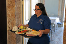 Front and center: Mariam Kansan, 27, a Palestinian with special needs, works at a boutique hotel ran by the Maan Lil-Hayaat, an organization which supports Palestinians with intellectual disabilities, in the biblical city of Bethlehem, in the occupied West Bank, on Aug. 26.