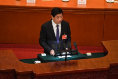 Li Zhanshu, chairman of the National People's Congress (NPC), delivers his work report during the second plenary session of the National People's Congress (NPC) at the Great Hall of the People in Beijing on March 8, 2022. 