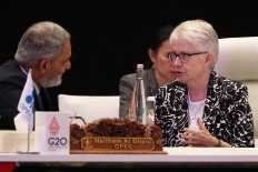 OECD deputy secretary-general Kerri Ann Jones (right) talks with OPEC secretary-general Haitham Al Ghais (left) during the G20 Energy Transitions Ministerial meeting in Nusa Dua on Sept. 2, 2022.
/ POOL / AFP