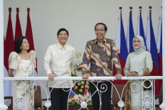 Philippine President Ferdinand Marcos Jr. (second left) and First Lady Louise Araneta Marcos (left) meet with President Joko "Jokowi" Widodo (second right) and First Lady Iriana Widodo at the Presidential Palace in Bogor, West Java, on Sept. 5.
