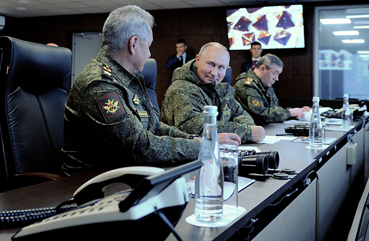 Russian President Vladimir Putin (C), Defence Minister Sergei Shoigu (L) and Chief of the General Staff of Russian Armed Forces Valery Gerasimov oversee the Vostok-2022 (East-2022) military drills at Sergeyevsky training ground in the far eastern Primorsky Region, Russia September 6, 2022.