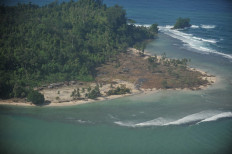 An aerial view shows the tsunami devastated Tumalei village in the Metawai islands, West Sumatra, on October 31, 2010 six days after a 7.7-magnitude quake-triggered tsunami hit the area. Indonesia ramped up aid operations Sunday for victims of last week's devastating tsunami, as the toll climbed despite the discovery of 135 traumatised villagers who were feared dead. 