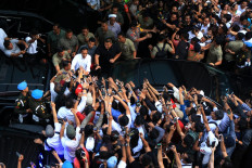 President Joko “Jokowi” Widodo greets his supporters after speaking to the press at the Djakarta Theater in Central Jakarta on April 17th 2019. Early counts showed the incumbent had won his reelection bid. 