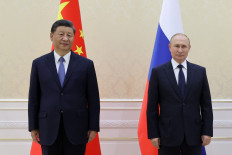 Putin congratulates Xi on new term, hails 'strengthening' ties