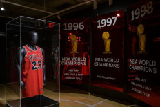 Another notch: The jersey Michael Jordan wore in Game 1 of the 1998 NBA Finals, dubbed 'The Last Dance' after the ESPN/Netflix documentary, is displayed on Sept. 6 during Sotheby’s Invictus sales in New York City. The jersey sold for a record US$10.1 million on Thursday.