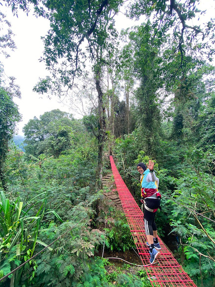 Into lush greenery: Pictured is Fifi Fiana running through Situ Gunung Suspension Bridge in Sukabumi, West Java. (Courtesy of Fifi Fiana)