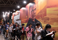 Grand data theft: Visitors queue to play the new Rockstar Games videogame Grand Theft Auto V at the Tokyo Game Show in Chiba, suburban Tokyo, on Sept. 19, 2013. Rockstar Games said on Monday that data from the next installment in its blockbuster Grand Theft Auto franchise was stolen, as glimpses of play spread on social media.