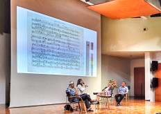 Dive into the book: (From left to right) Dr. A. Setyo Wibowo, Ayu Utami, Berthold Damshauser and the moderator discuss the book at the Goethe Institute in Jakarta on Aug. 27. Displayed on the screen is an old musical piece, Geburtstag Symphonie, composed by Nietzsche. (JP/Sylviana Hamdani)