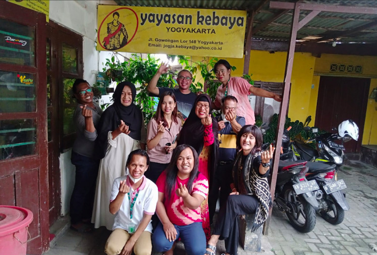 Safe space: 'Bunda' (Mother) Rully Mallay (second left) is pictured with friends at the Yayasan Kebaya Yogyakarta during a donor visit on Sept. 10. (Courtesy of Rully Mallay)