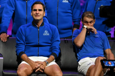 Switzerland's Roger Federer (left) sheds a tear after playing his final match, a doubles with Spain's Rafael Nadal (right) of Team Europe against USA's Jack Sock and USA's Frances Tiafoe of Team World in the 2022 Laver Cup at the O2 Arena in London, early on September 24, 2022. 