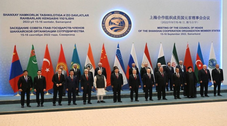 Participants of the Shanghai Cooperation Organization summit pose for a photo on Sept. 16, 2022, before an extended-format meeting of heads of SCO member states in Samarkand, Uzbekistan. 