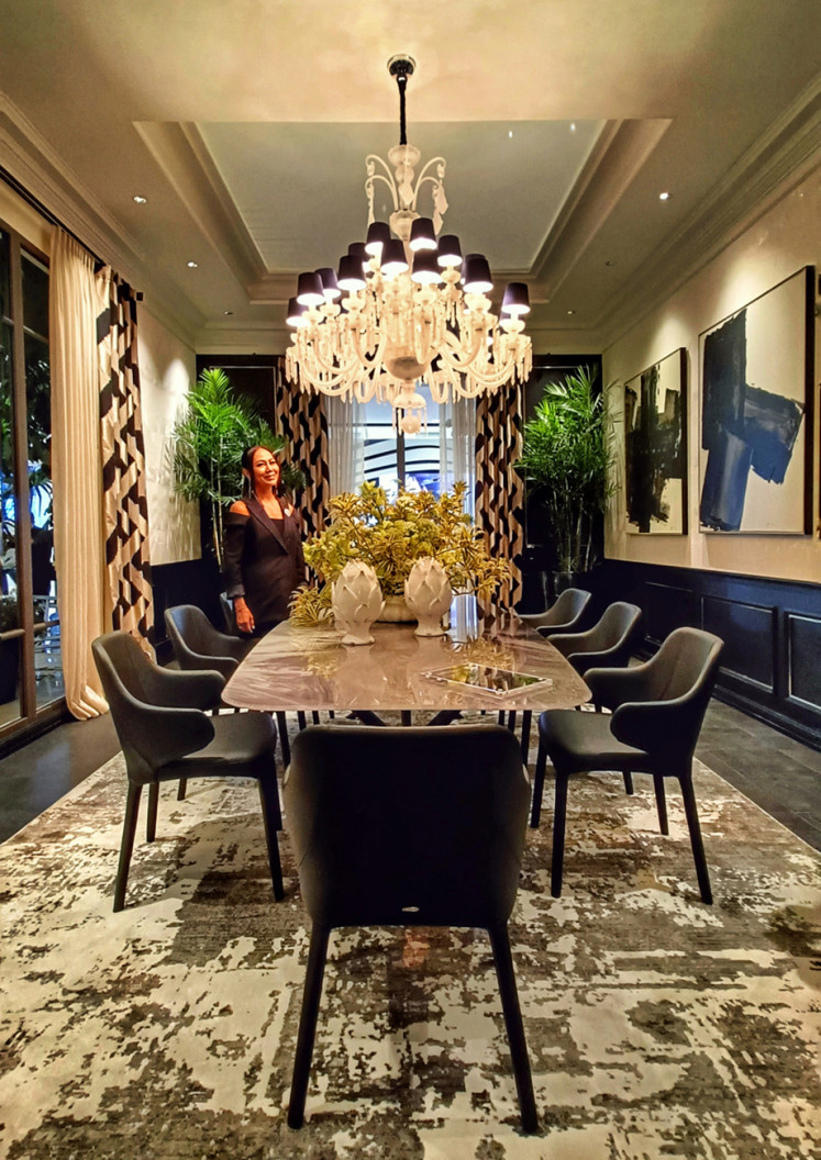 Family time: According to interior designer Anita Boentarman, many of her clients redesign their dining rooms with leather chairs and modern-style frosted chandelier, as the pandemic brings families to dine together at home. (JP/Sylviana Hamdani)