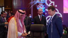 Saudi Arabian Minister of Commerce Majid bin Abdullah Al-Qasabi (front left) and Russian Deputy Minister for Economic Development Vladimir Ilichev (front right) talk in the conference room before the opening of the Group of 20 Trade, Investment and Industry Ministerial Meeting (TIIMM) in Bali on Sept. 22, 2022.