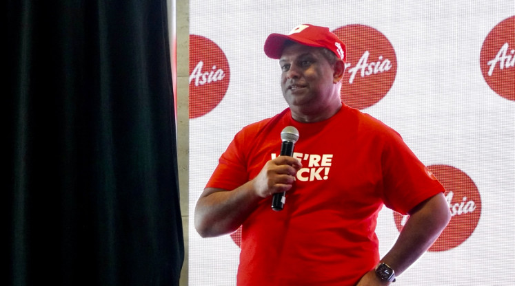 Tony Fernandes, CEO of AirAsia parent company Capital A Behad speaks during the celebration of the resumption of AirAsia’s operations at Terminal 4 of Singapore’s Changi Airport on Sept. 15.