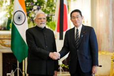 India's Prime Minister Narendra Modi (left) shakes hands with Japan's Prime Minister Fumio Kishida before their meeting at the Akasaka Palace state guest house in Tokyo on September 27, 2022, ahead of the state funeral for Japan's former prime minister Shinzo Abe. 
