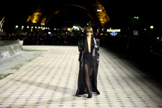 Saint Laurent heats up Eiffel Tower runway with sizzling Parisian glamour