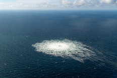 This handout picture released on September 27, 2022 by the Danish Defence Command shows the gas leak at the Nord Stream 2 gas pipeline as it is seen from the Danish Defence's F-16 rejection response off the Danish Baltic island of Bornholm, south of Dueodde. The two Nord Stream gas pipelines linking Russia and Europe have been hit by unexplained leaks, Scandinavian authorities said on September 27, 2022, raising suspicions of sabotage. The pipelines have been at the centre of geopolitical tensions in recent months as Russia cut gas supplies to Europe in suspected retaliation against Western sanctions following its invasion of Ukraine.
