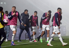 Gimnasia y Esgrima players react after police fired tear gas and entered the Juan Carmelo Zerillo stadium during the Argentine Professional Football League 2022 Tournament match between Gimnasia y Egrima and Boca Juniors in La Plata, Argentina on October 6, 2022. A supporter of the Gimnasia soccer club died during serious incidents that broke out during an Argentine league match between his team and Boca Juniors on Thursday in Buenos Aires, according to local authorities.