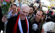 In this file photo taken on June 21, 2014 Belarus prominent rights activist Ales Belyatsky arrives in the capital Minsk after being released from jail.