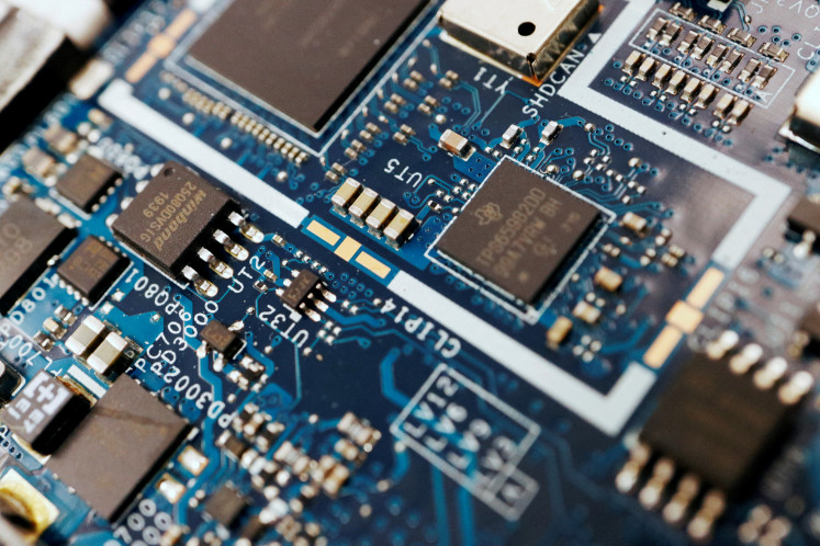 Semiconductor chips are seen on a circuit board of a computer in this illustration picture taken on Feb. 25, 2022.