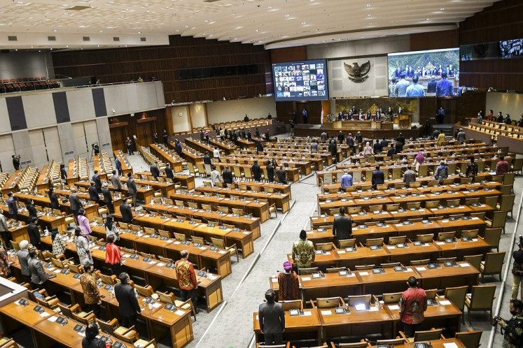 Lawmakers attend a House of Representatives plenary session on March 8, 2021, in Jakarta. 