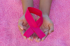 To live another day: cancer survivors gain strength from trials