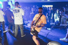 Jammin': Pictured is Mohammad Tezar (center, on guitar) in the middle of Hockey Hook's performance at Pesta Pora, a music festival held in Jakarta, on Sept. 23. (Courtesy Ibrahim Partogi)