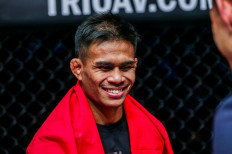 Ready to rumble: Indonesian mixed martial arts (MMA) athlete Eko Roni Saputra, of Singapore’s Evolve MMA, smiles in this undated photograph. He faces Thailand’s Yodkaikaew “Y2K” Faitex on Oct. 21 in Kuala Lumpur, which he plans to dedicate to his late father-in-law, his “biggest supporter”.