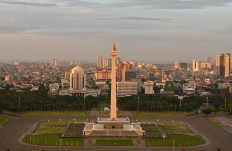 The iconic National Monument, with its gold flame, towers over the Central Jakarta skyline on Feb. 10, 2020. 