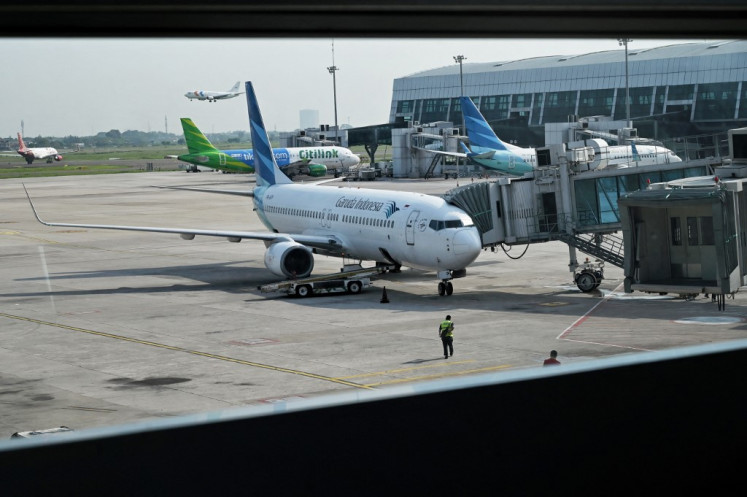 A Garuda Indonesia airplane is parked at Soekarno Hatta International Airport in Tangerang, Banten, on May 14, 2022.