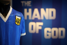 Historic jersey: A football shirt worn by Argentina's Diego Maradona during the 1986 World Cup quarter-final match against England, is pictured during a photocall at Sotheby's auction house in London on Apr. 20, ahead of its sale. 