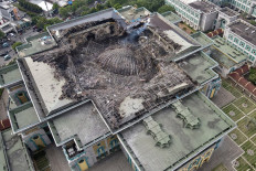This aerial picture taken on October 20, 2022 shows the smouldering remains of the collapsed dome of the Islamic Centre mosque in Jakarta, which caught fire during ongoing renovation work. 
