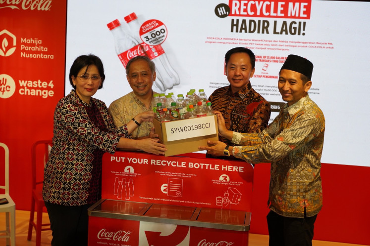Director of Public Affairs, Communications, and Sustainability Indonesia and PNG Coca-Cola Europacific Partners Lucia Karina (left), director of Public Affairs, Communications and Sustainability PT Coca-Cola Indonesia Triyono Prijosoesilo, chairman of Mahija Parahita Nusantara Foundation Hery Gunawan and managing director of Waste4Change Mohamad Bijaksana Junerosano (right) at the launch of the Recycle Me program, which will run for three months from Oct. 20-Dec. 20.