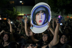 Fans of South Korean K-Pop boy band unable to attend the show, gather outside the River Plate's Monumental stadium to listen to Kim Seok-jin -aka Jin- perform his single solo “The Astronaut“ with British rock band Coldplay, during the third of ten concerts of their “Music of the Spheres“ world tour, in Buenos Aires, on October 28, 2022. 
