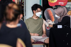 Indonesia's COVID-19 caseload surges to 8,000 per day