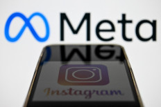 Social network Instagram's logo appears on a smartphone screen in Moscow on Oct. 28.