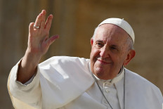 Meat-free?: Pope Francis waves at the end of his weekly general audience at Saint Peter's Square in the Vatican on Oct. 26. United Kingdom researchers suggested on Tuesday that Pope Francis I encourage Catholics to return to no-meat Fridays to help reduce global carbon emissions. 