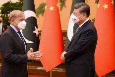 This handout picture released by the Pakistan Prime Minister Office on November 2, 2022, shows Pakistan Prime Minister Shahbaz Sharif (left) speaks with China's President Xi Jinping prior to their talks at the Great Hall of the People in Beijing, China.
