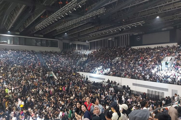 A massive concert crowd at an event in the year 2022