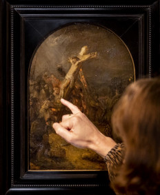 A visitor looks at The Creation of Jesus on the Cross by Rembrandt on display at Museum Bredius in The Hague on November 3, 2022.