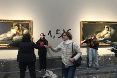 Climate activists glue hands to Goya frames at Spain's Prado