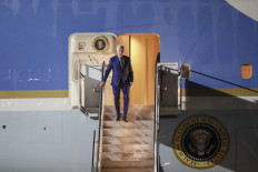 US President Joe Biden disembarks from Air Force One upon arrival at Ngurah Rai International Airport in Denpasar, Bali, on Nov. 13, 2022, to attend the G20 Summit.
