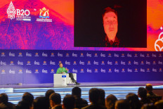 Tesla CEO and Twitter owner Elon Musk (right) speaks virtually with Anindya Bakrie (left), chairman of Supervisory Board of Indonesian Chamber of Commerce and Industry, at the B20 Summit as part of the G20 dialogue in Nusa Dua, Bali, on Nov. 14, 2022.
ADITYA PRADANA PUTRA / POOL / AFP