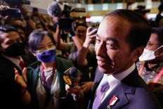 President Joko “Jokowi” Widodo reacts as journalists ask questions during his visit to the media center ahead of the G20 Leaders’ Summit in Nusa Dua, Bali, on Nov. 14.