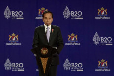 President Joko "Jokowi" Widodo delivers his closing speech during the B20 Summit as part of the G20 dialogue, in Nusa Dua on the resort island of Bali on Nov. 14, 2022.